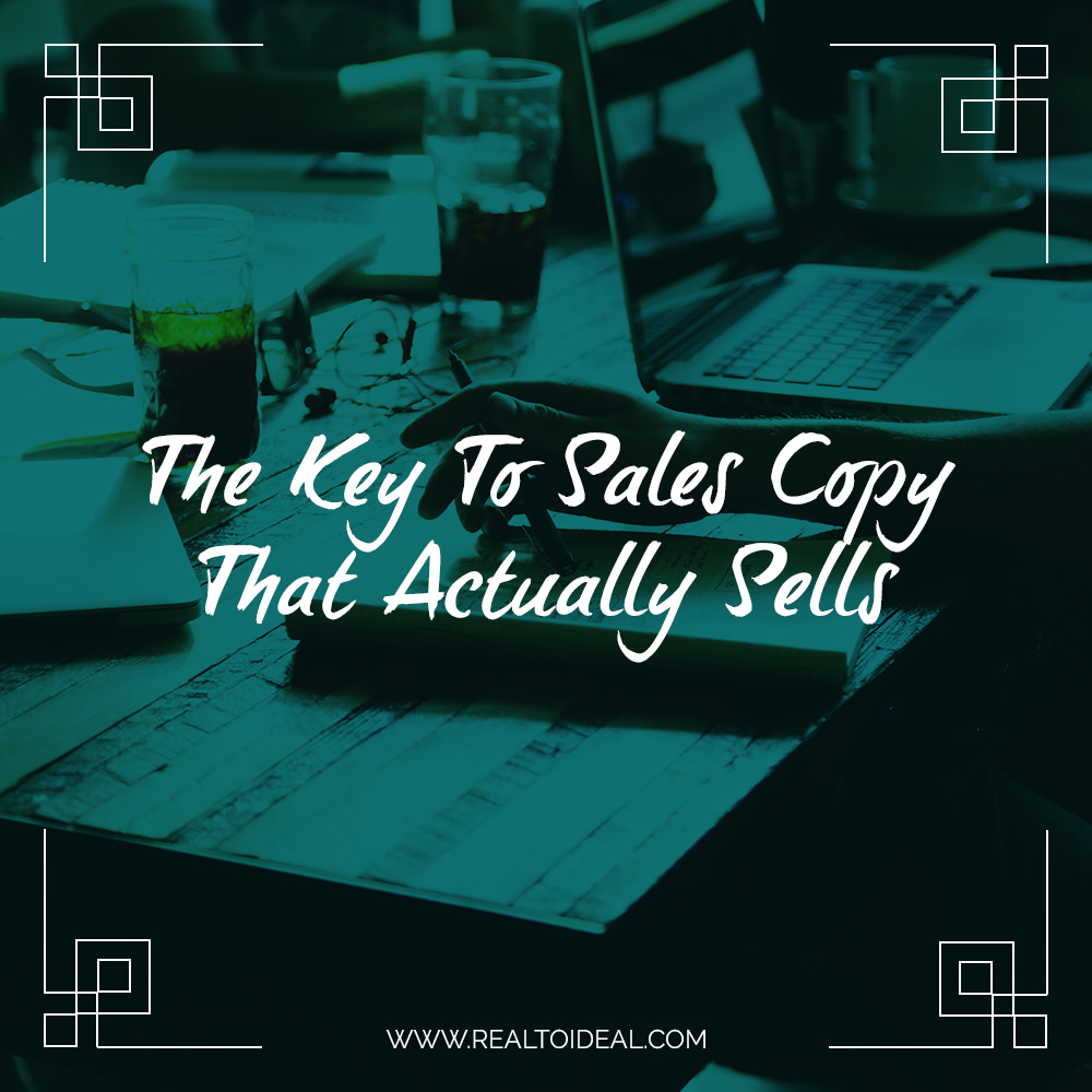 a desk covered in papers, laptop, drinks and more with the caption: The Key To Sales Copy That Actually Sells