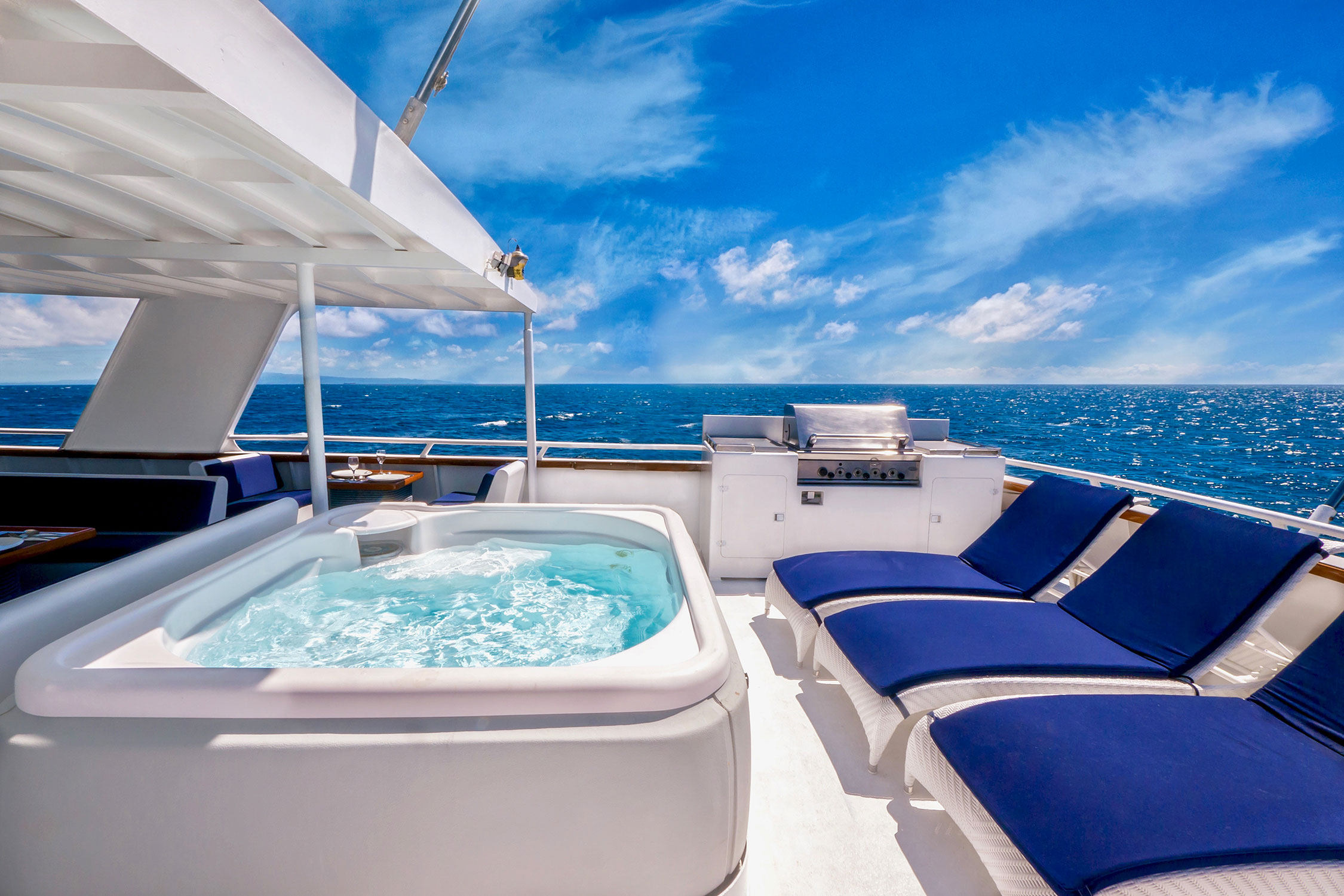 Give your ideal clients a way to travel in style through your sales funnel and they'll arrive ready to buy! Luxury yacht with jacuzzi and deck blue chairs.